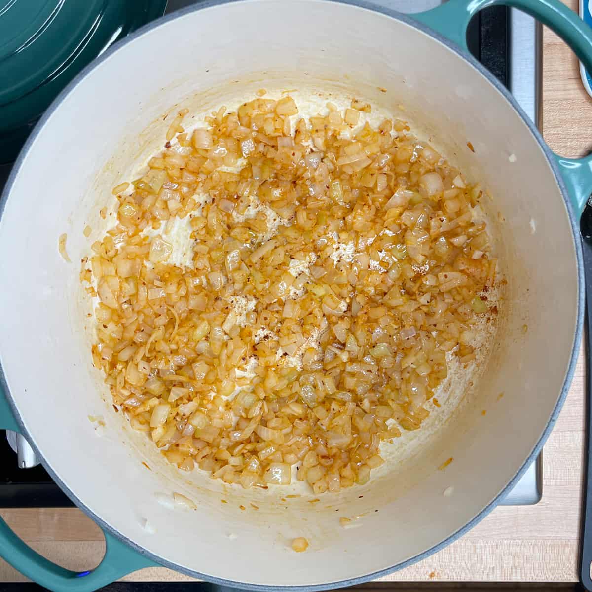 sauteed onions and garlic with spices in a large Dutch oven.