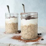 2 jars of tiramisu overnight oats showing the layers and a spoon in each jar.