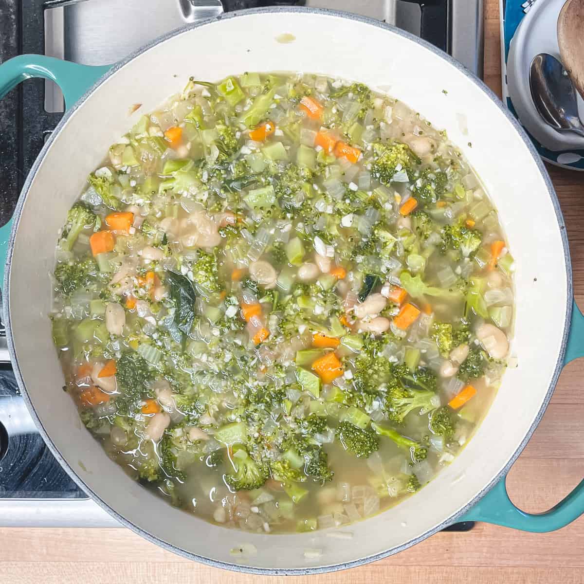 broccoli soup in a soup pot after cooking but before being pureed.