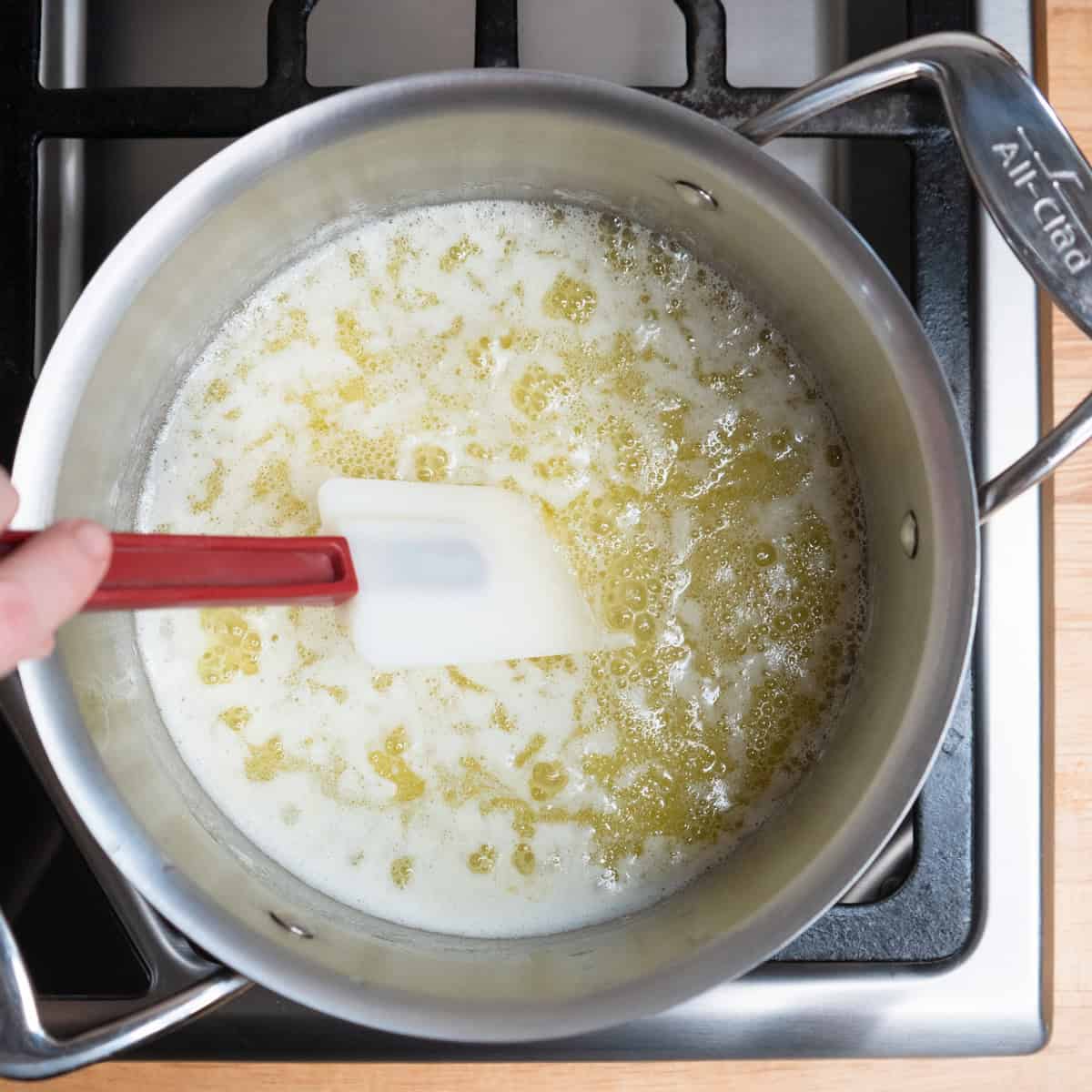 Melted butter bubbling in a small saucepan.