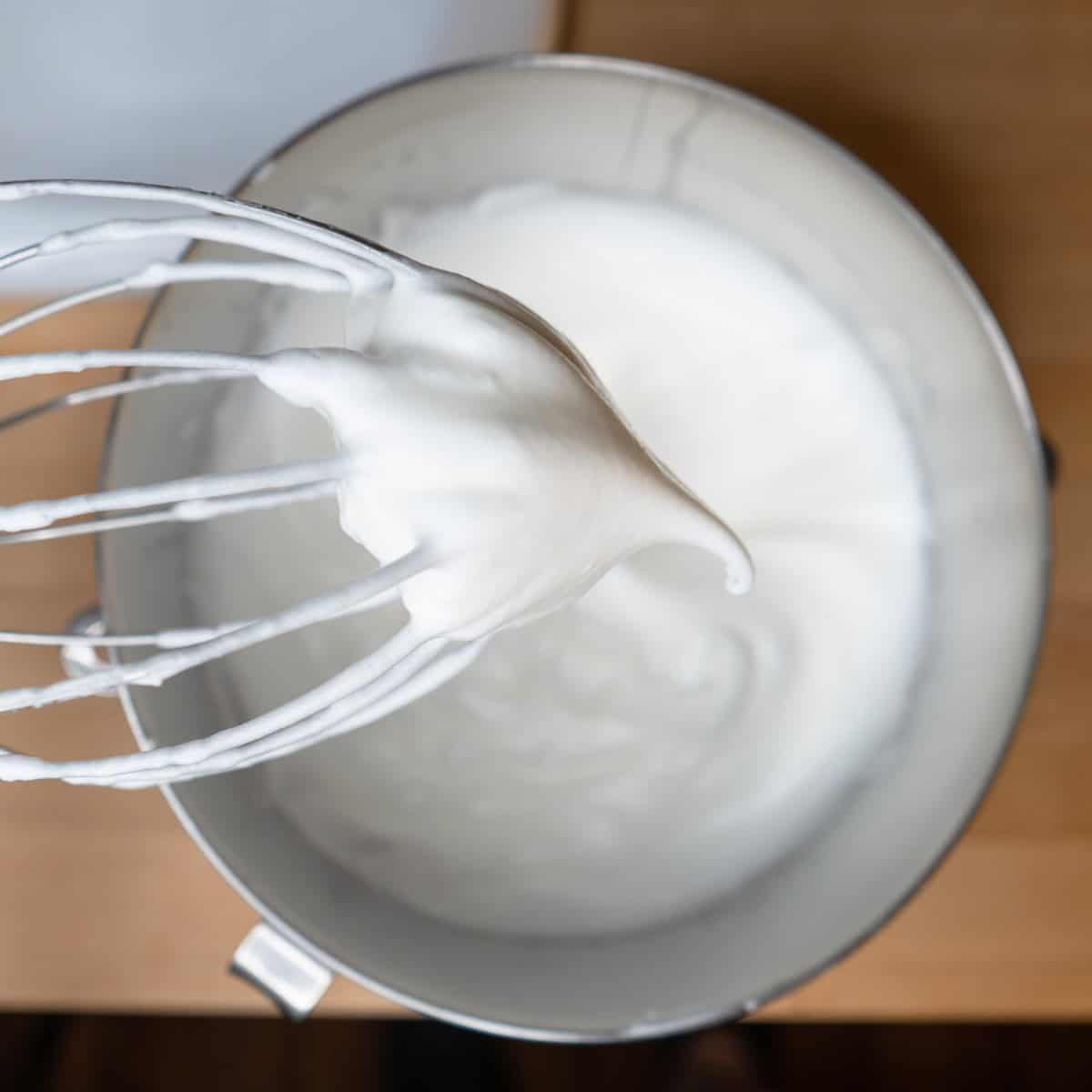 Egg whites whipped to medium-soft peaks.
