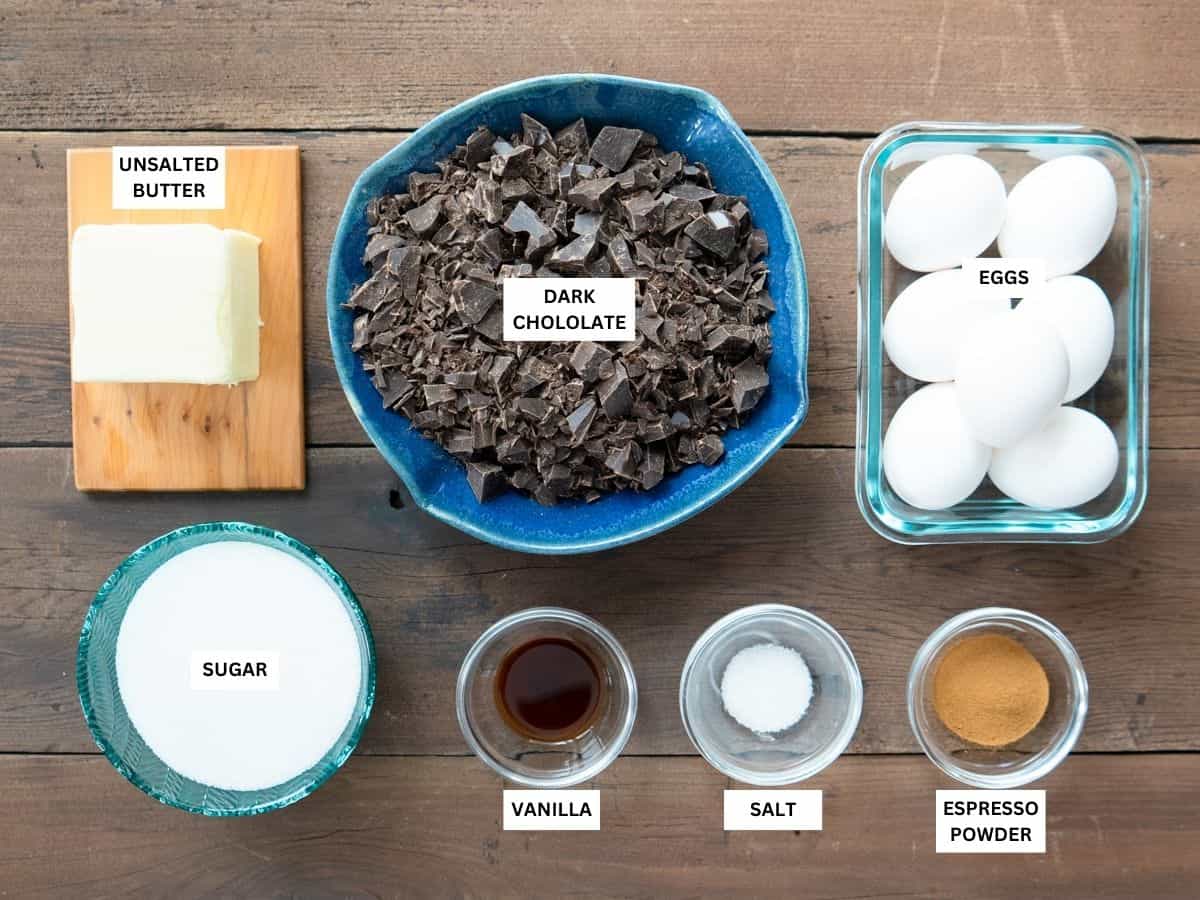 All the ingredients to make chocolate souffle cake measured out and labeled.