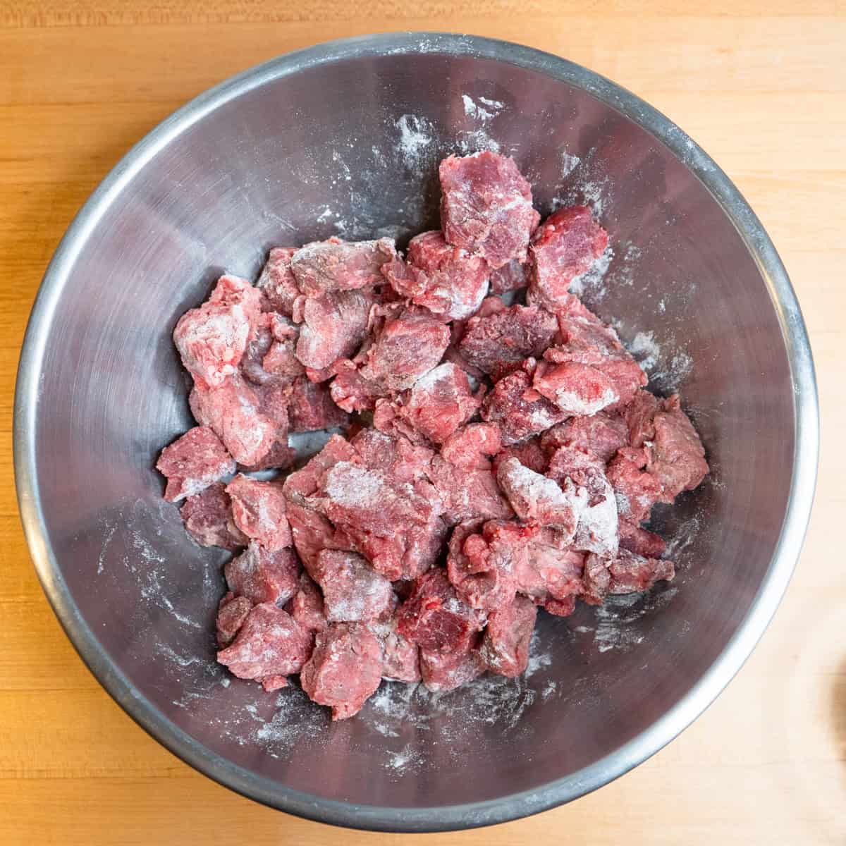 Beef cubes tossed with flour, salt and pepper.