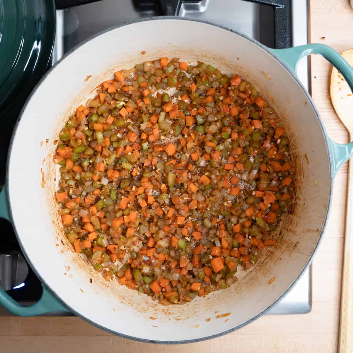 Vegetables browning in a pot.