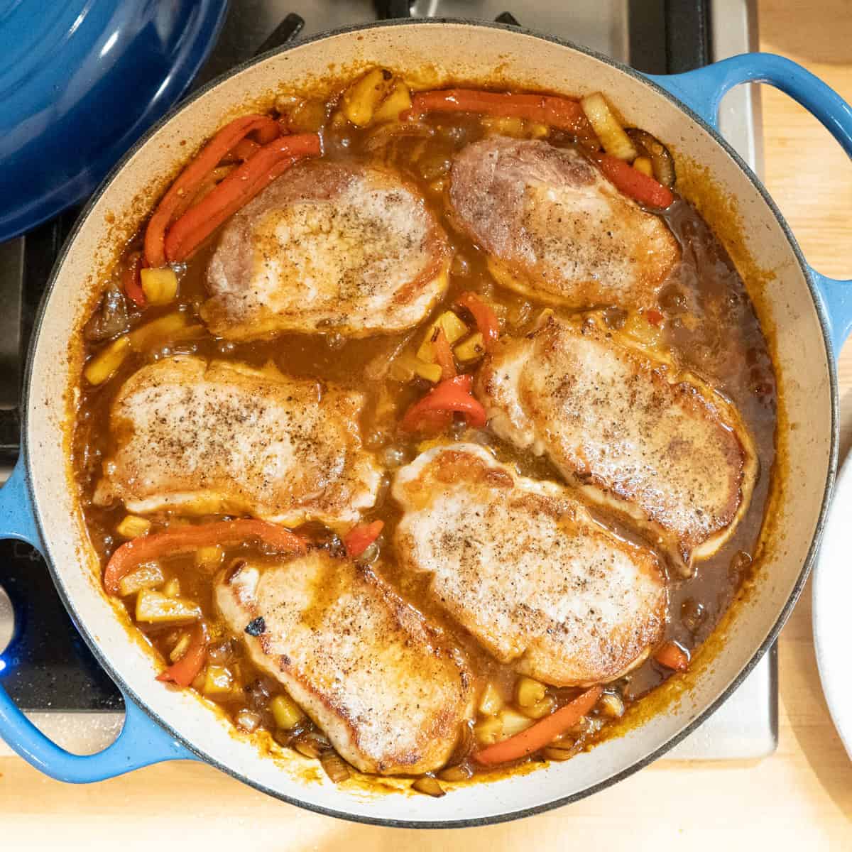 boneless pork chops nestled into sweet and sour pineapple sauce.