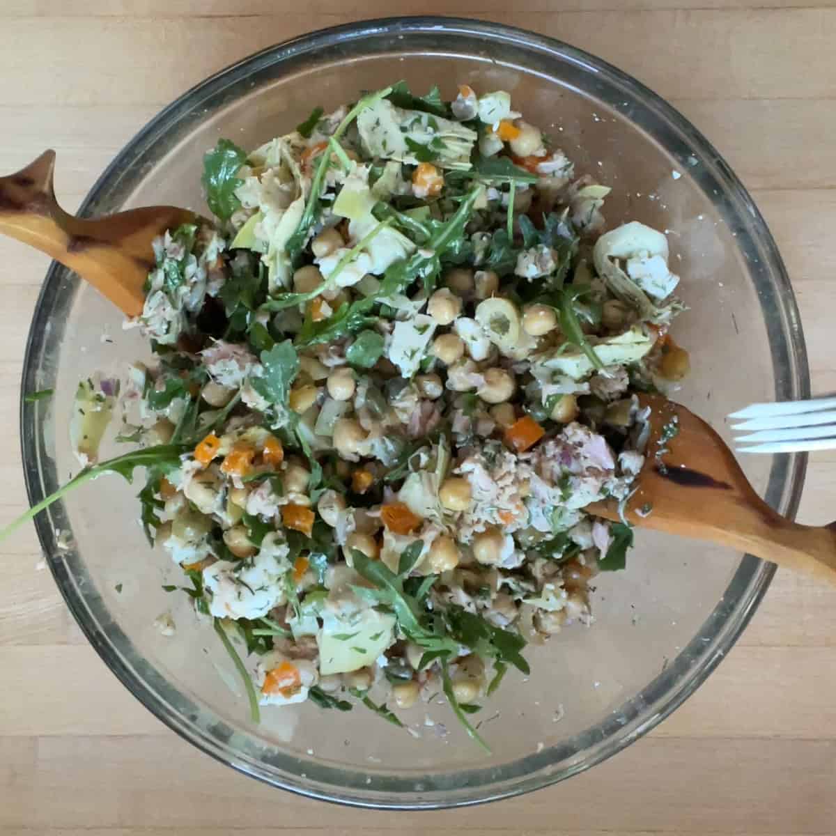Chickpea tuna salad mixed together in a glass bowl.